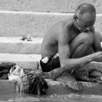 Man washing in Varanasi Banaras India
