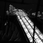 black and white picture of close up of the empire state building tower by night in new york city NYC USA