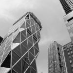 Black and white photo of the nusual skyscraper in New York City NYC: the Hearst tower building designed by architect Norman Foster