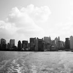 view of new york city from the boat to ellis island NYC USA in black and white