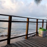 man waiting for the sunset in Pipa beach Brazil
