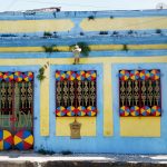 facade of a blue and yellow house in the colonial city of Olinda Brazil