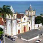 view on the Church of Sao Salvador do Mundo and the sea in Olinda Pernambuco in Brazil as seen from the top of the Caixa d’Agua Alto da Se