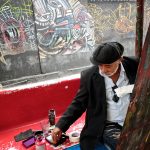 Paintor, sculptor and muralist Salvador Gonzalez Escalaona painting in the street of Callejon de Hamel in la Havana Cuba 2016