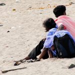sitting on the Mumbai Versova beach in 2011