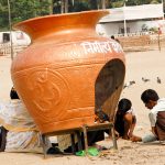 locals by a temple on Versova beach in Mumbai India
