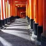 reflections between the torii gates of the Fushimi Inari shrine in Kyoto, shrine dedicated to INARI, the god of Rice and Sake