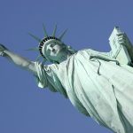 a close up of the statue in Liberty on Ellis island New York