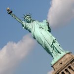 the green statue of liberty on Ellis Island in new york city